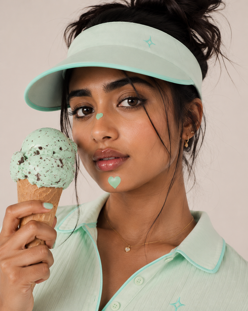 a woman holding an ice cream cone